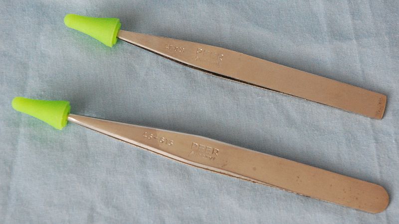 photo of tweezers with point ocver on tips